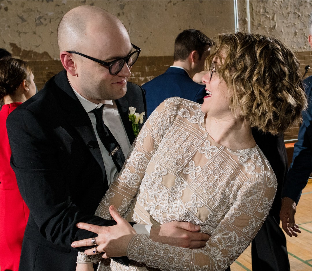 A bride and groom embrace and look at each other while dancing during their Ace Hotel wedding.