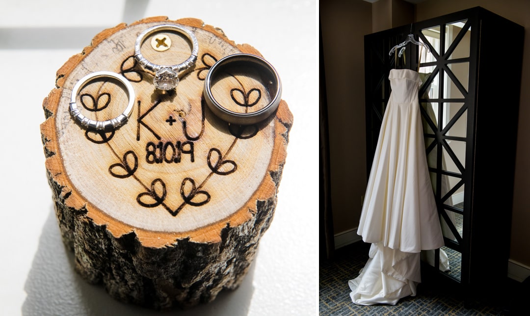 A detail photo of a decorative ring box made of a piece of a log and a bride's white gown hanging on a mirrored armoire.