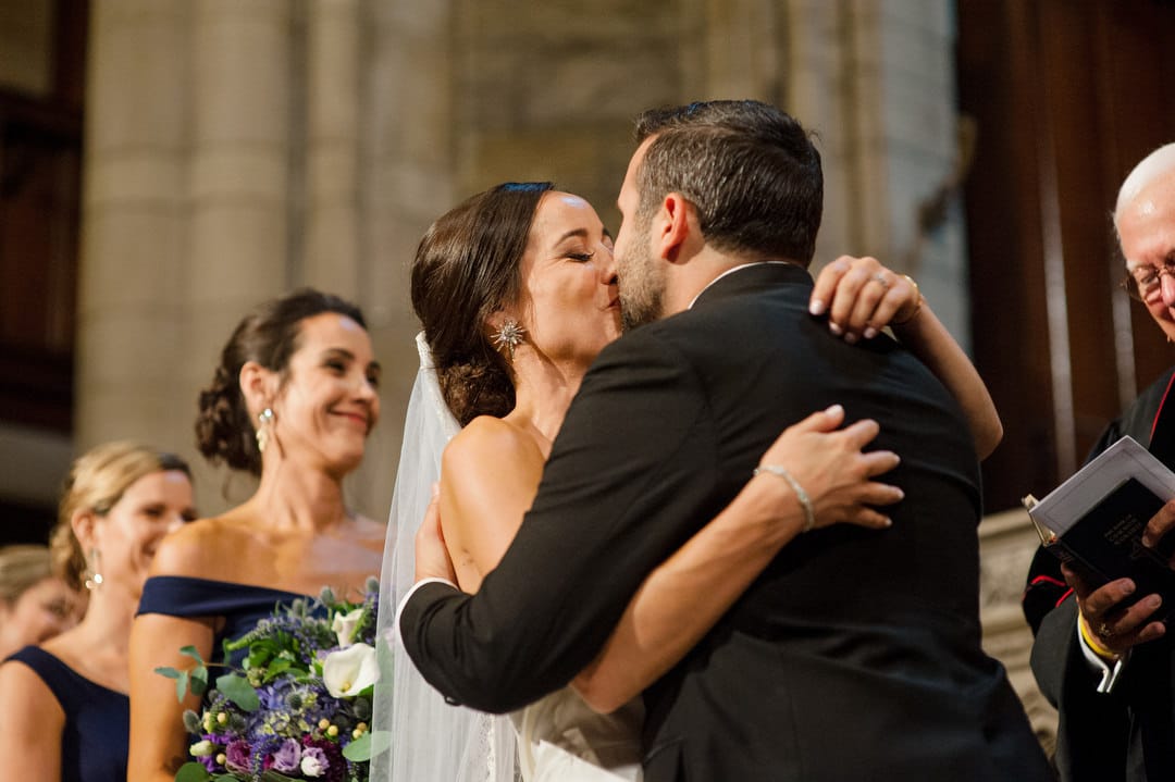 A bride and groom kiss as they are pronounced husband and wife during their wedding at the First Presbyterian Church in Pittsburgh.