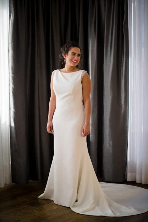 A bride smiles and looks to the right during a portrait session at the Hotel Monaco in Pittsburgh.