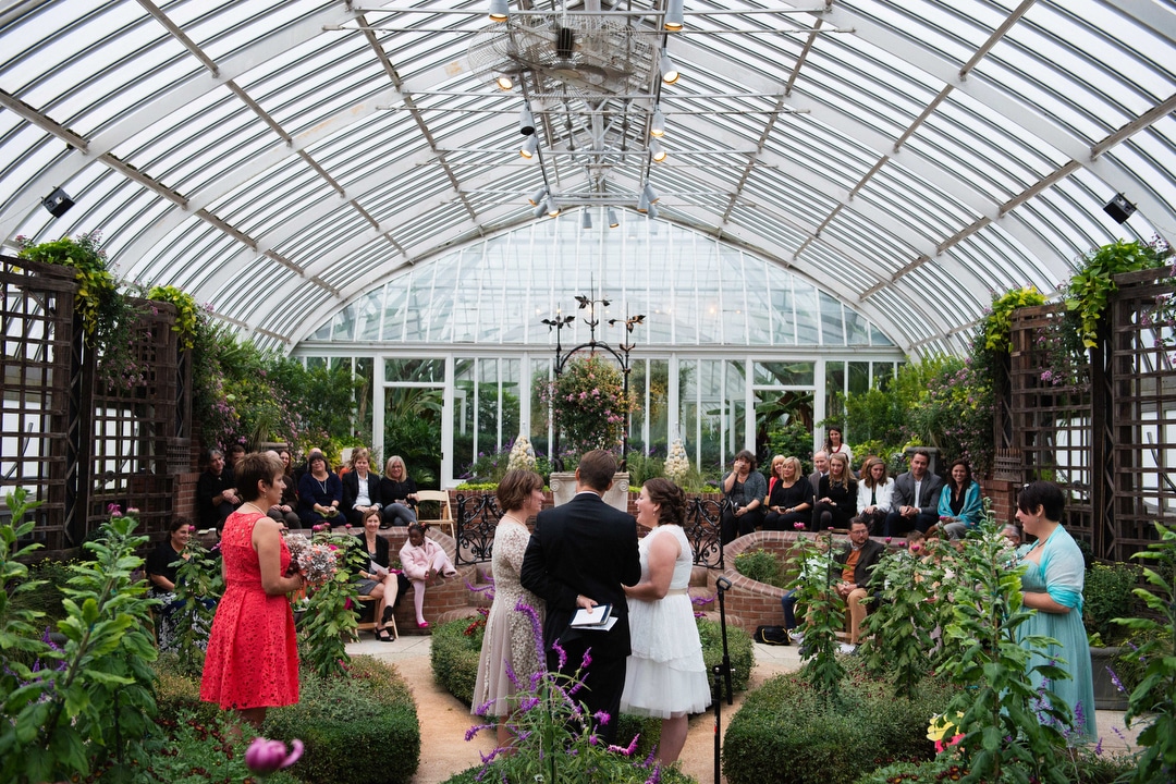A same sex couple is wed in the broderie room during their small wedding at Phipps.
