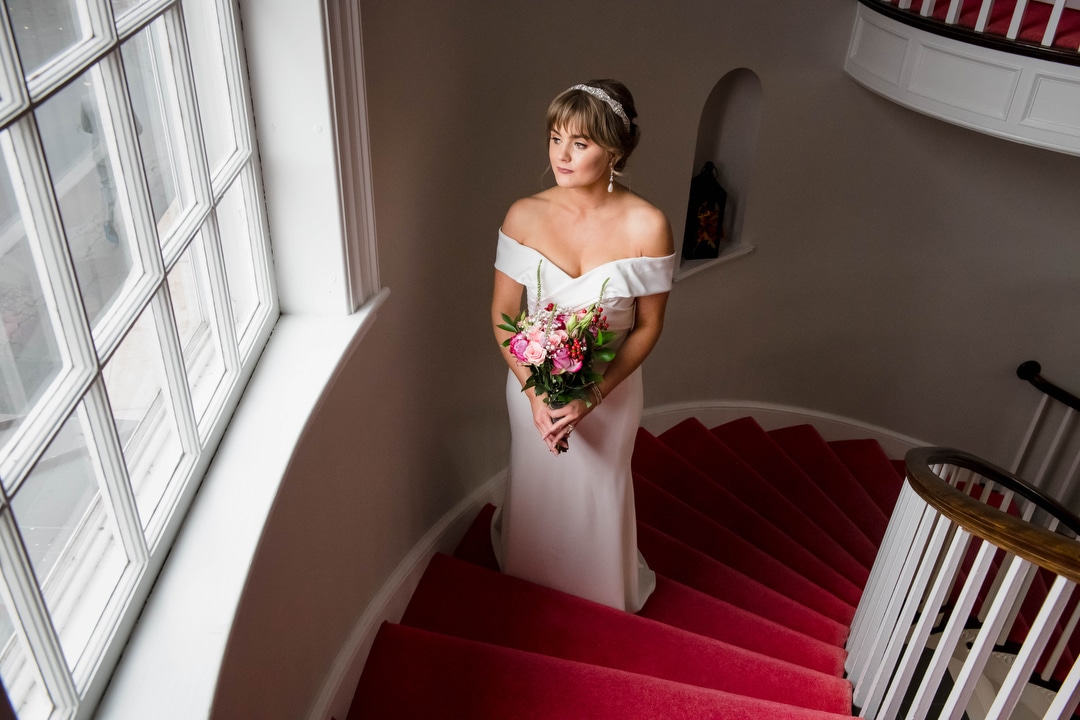 Portrait of a bride on a stairway.