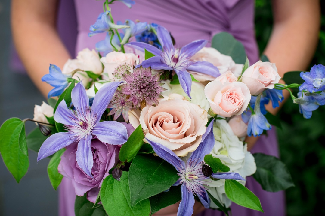Closeup of a bouquet with pale purple and green color scheme.