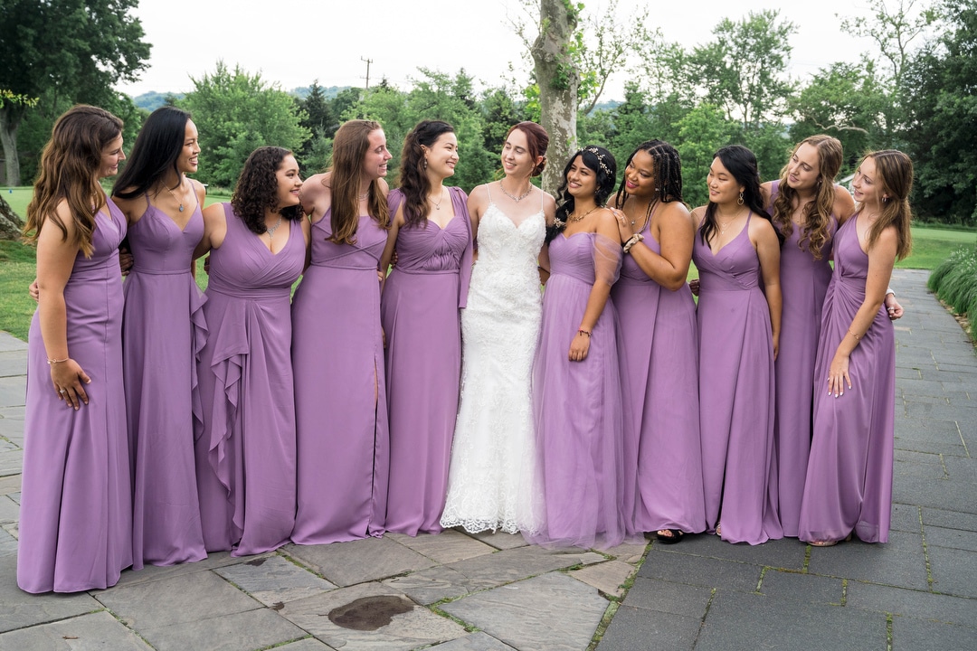 Bridesmaids stand with the bride before her wedding at the Oakmont Country Club.