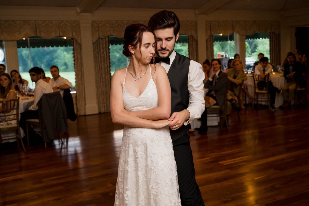 A bride and groom during their first dance during their wedding at Oakmont Country Club.