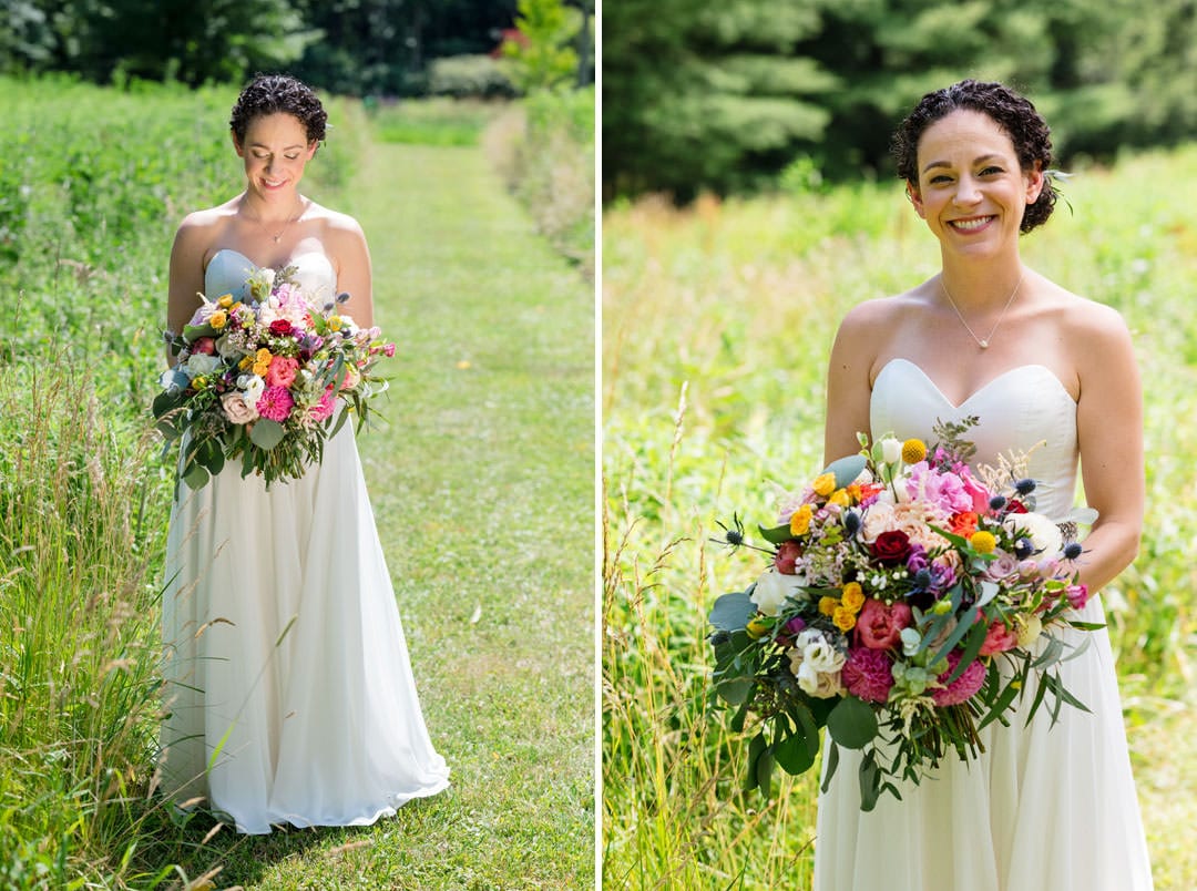 A bride wearing a strapless white dress holds a bouquet of flowers in a grassy field before her Gardens of Stonebridge wedding.