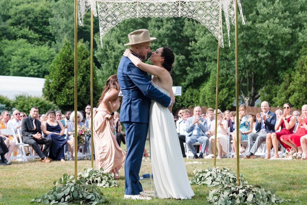A couple kisses during their Gardens of Stonebridge Wedding.