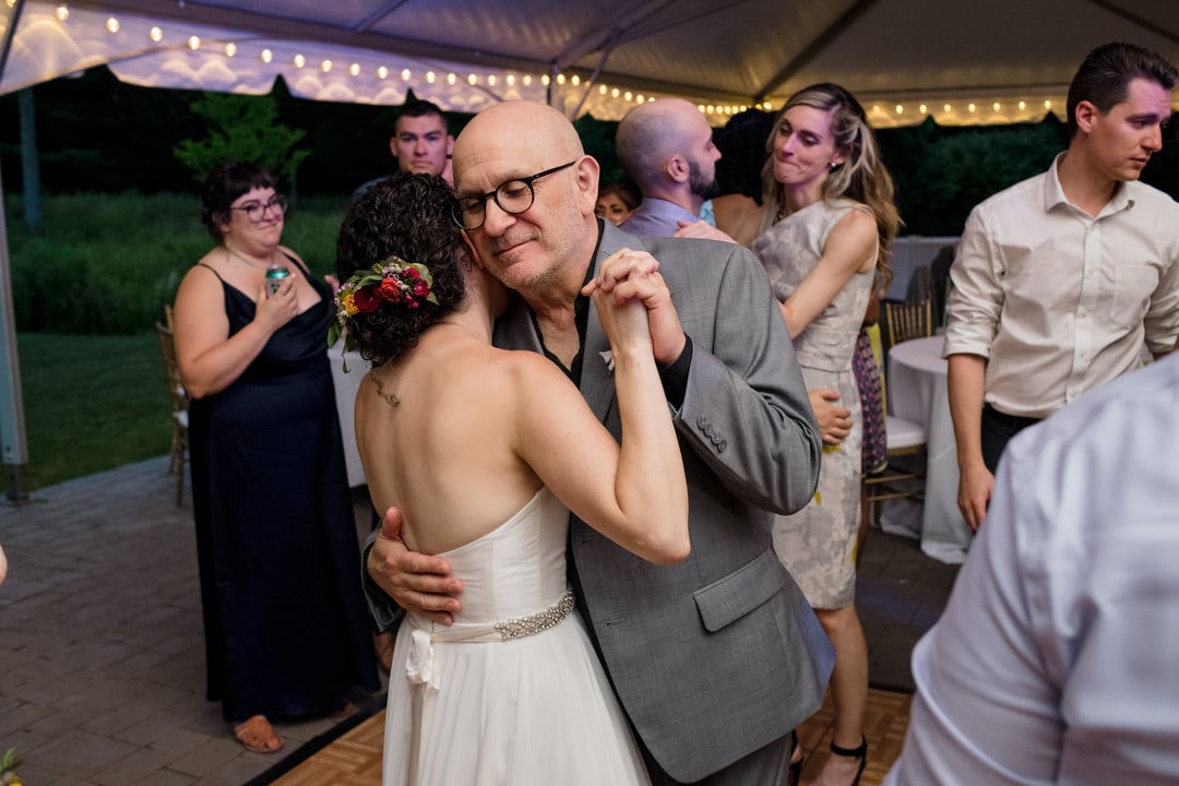 Bride dances with her dad during a wedding at the Gardens of Stonebridge