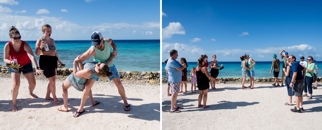 A groom dips his bride then the couple kisses as they rehearse for their wedding on a beach in Aruba. 