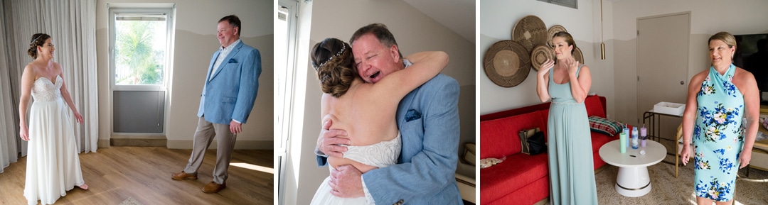 The father of the bride sees her for the first time in her dress. He cries as he hugs her.