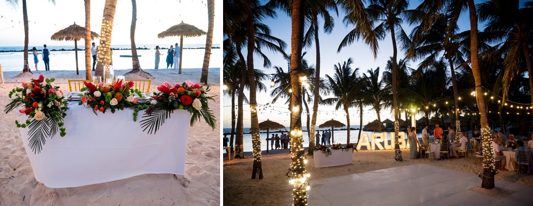 A sweetheart table and reception venue including dance floor and lighted ARUBA sign at a destination wedding.