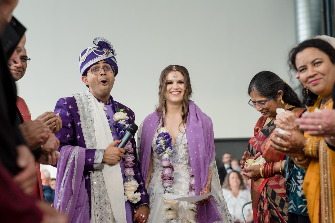 A bride and groom participate in a wedding ceremony at the Energy Innovation Center.