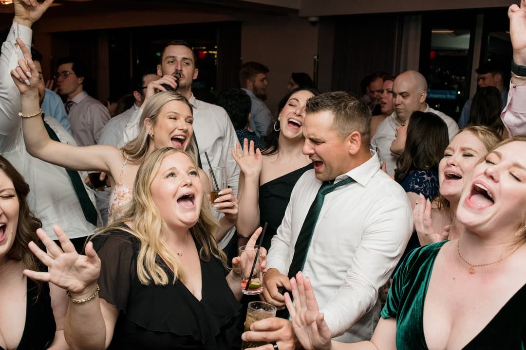 Guests sing and dance during a wedding reception at the Renaissance hotel in Pittsburgh.