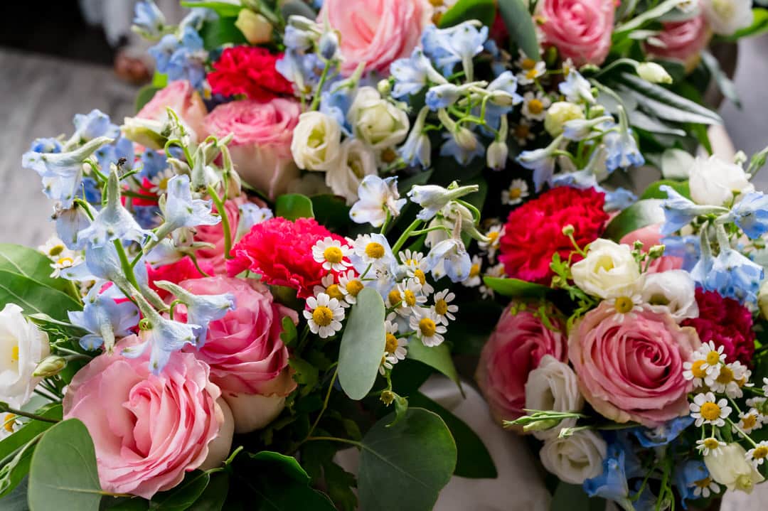 A bouquet of pink, red, white and blue flowers.