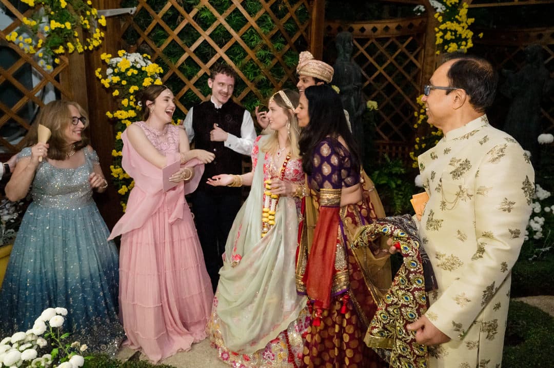 A bride and groom rejoice with their families at the end of their intimate wedding at Phipps.