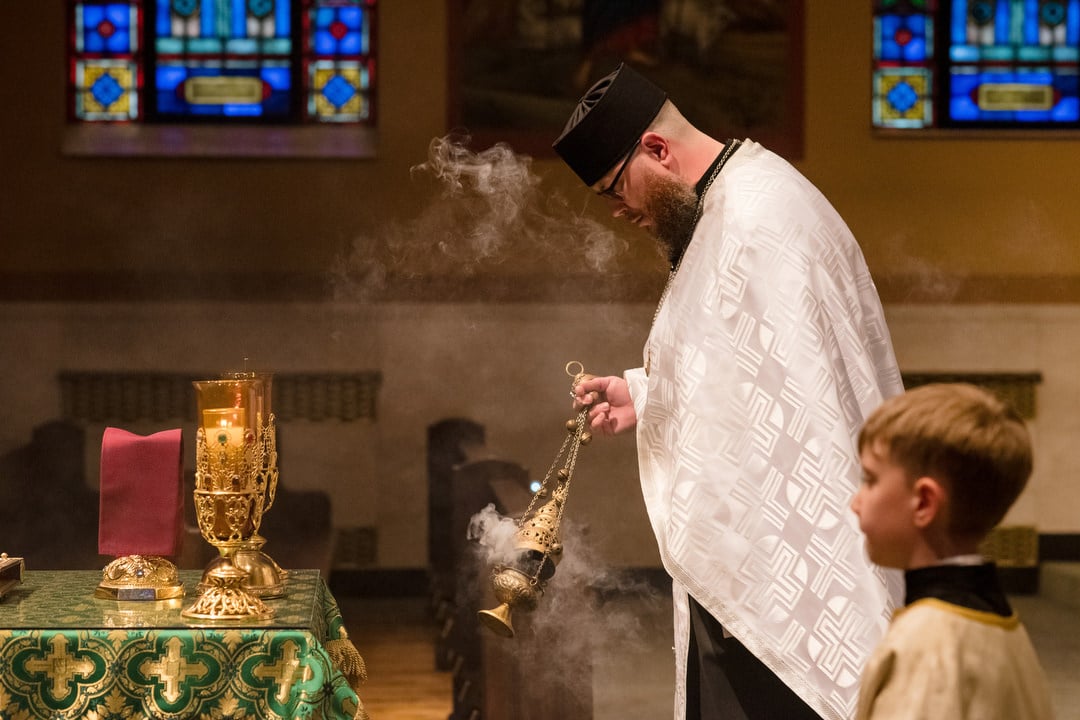 A Byzantine Catholic priest uses incense to bless the church during a wedding ceremony.