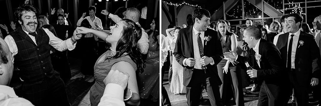 People are dancing and laughing at a lively indoor wedding in Pittsburgh. The black-and-white photos capture men in suits and women in dresses enjoying the music. Strings of lights and large windows, reminiscent of Springwood charm, create a festive atmosphere.