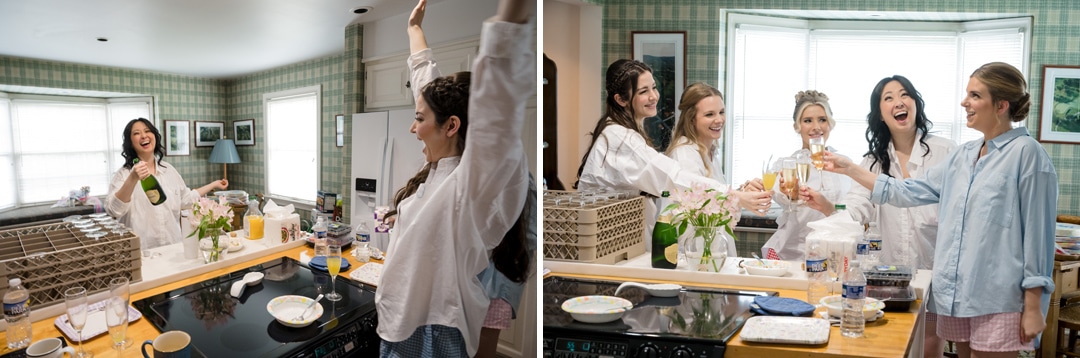 Two side-by-side photos show five women in a bright kitchen, wearing pajamas. In the left image, one celebrates with arms raised while another opens champagne. In the right, the group toasts with glasses, all smiling and happy.