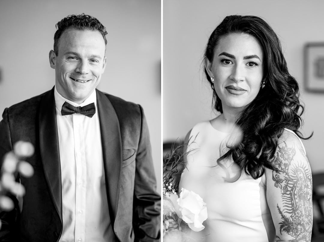 Black and white split image of a man in a tuxedo and bow tie on the left, smiling, and a woman in a white dress with wavy hair and visible tattoos on her arm, holding flowers, on the right.